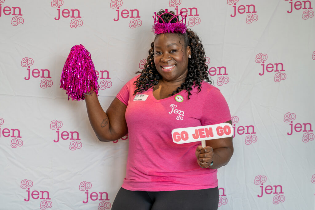 Adia posing at our backdrop at Day of Hope